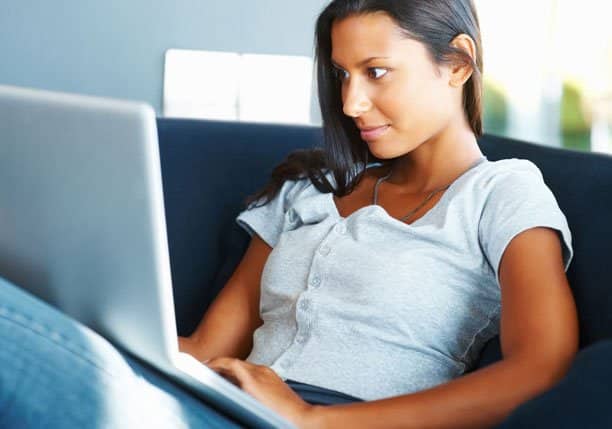 girl sitting with a laptop computer